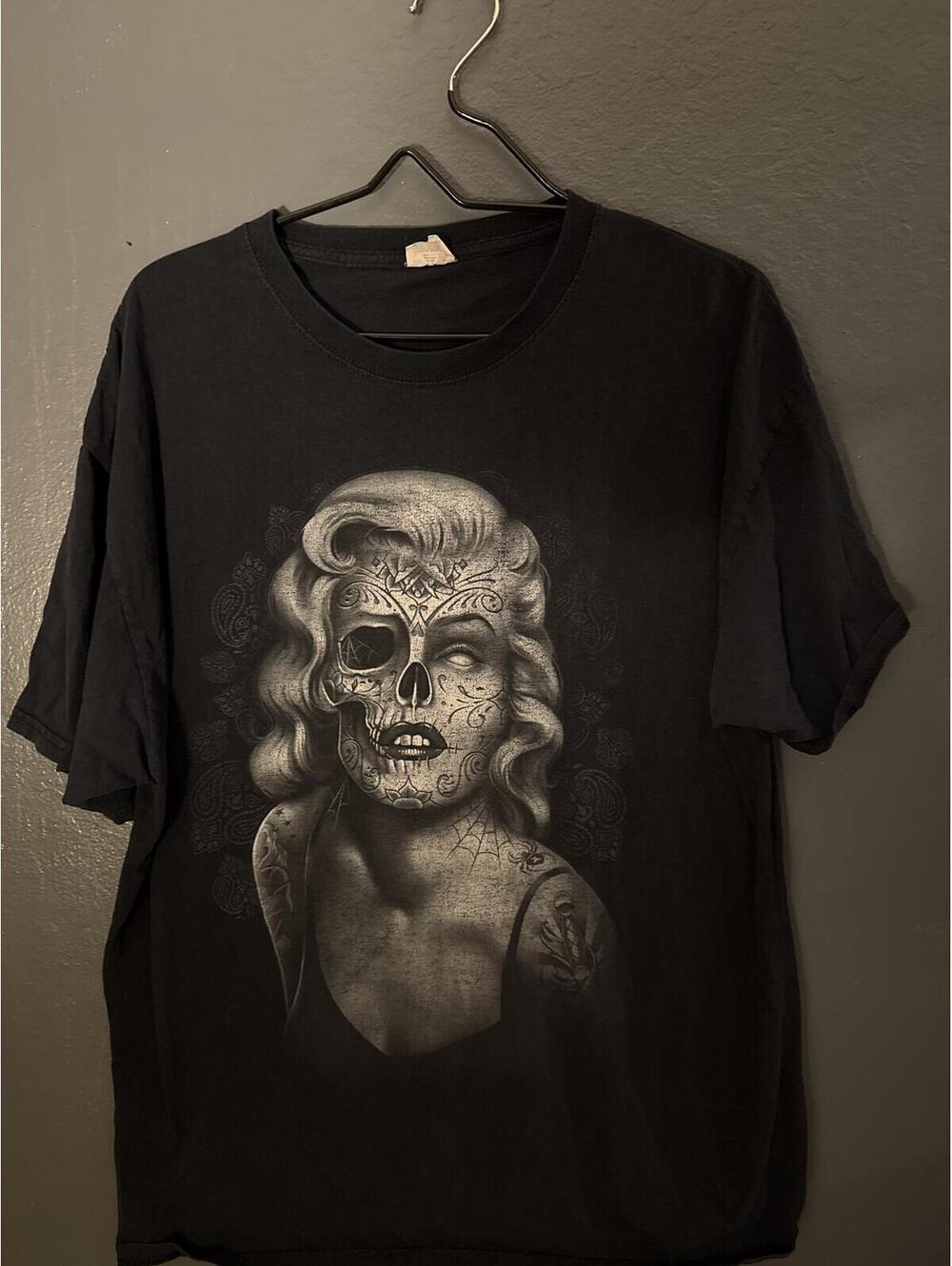 Black Graphic T-Shirt with Skull and Floral Tattoo Design